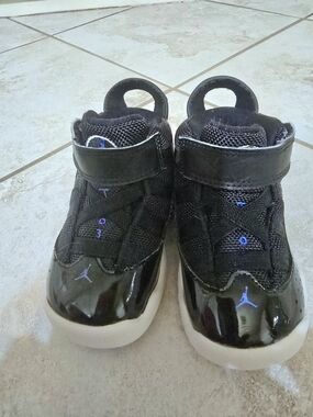 Jordan Kids Black High-Top Sneakers with Blue Jumpman Accents